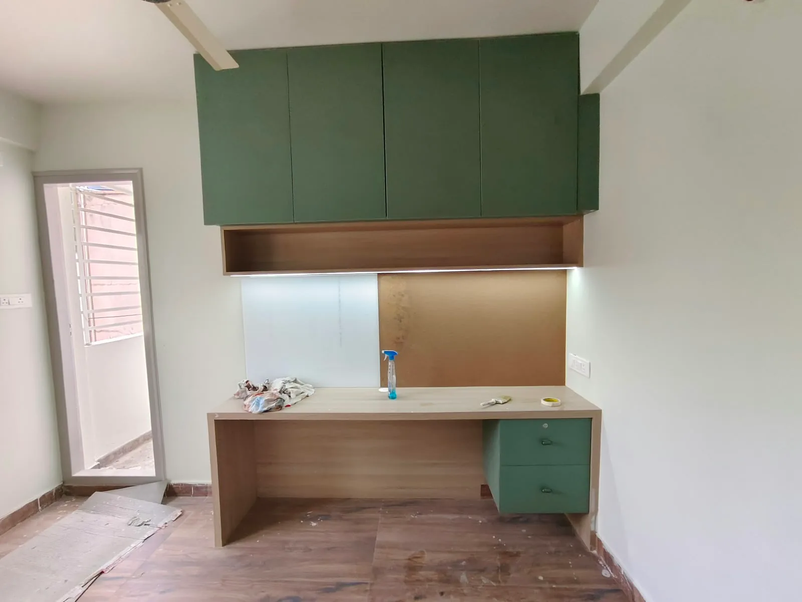 Avenza project work: Study unit desk with overhead cabinetry and task lighting